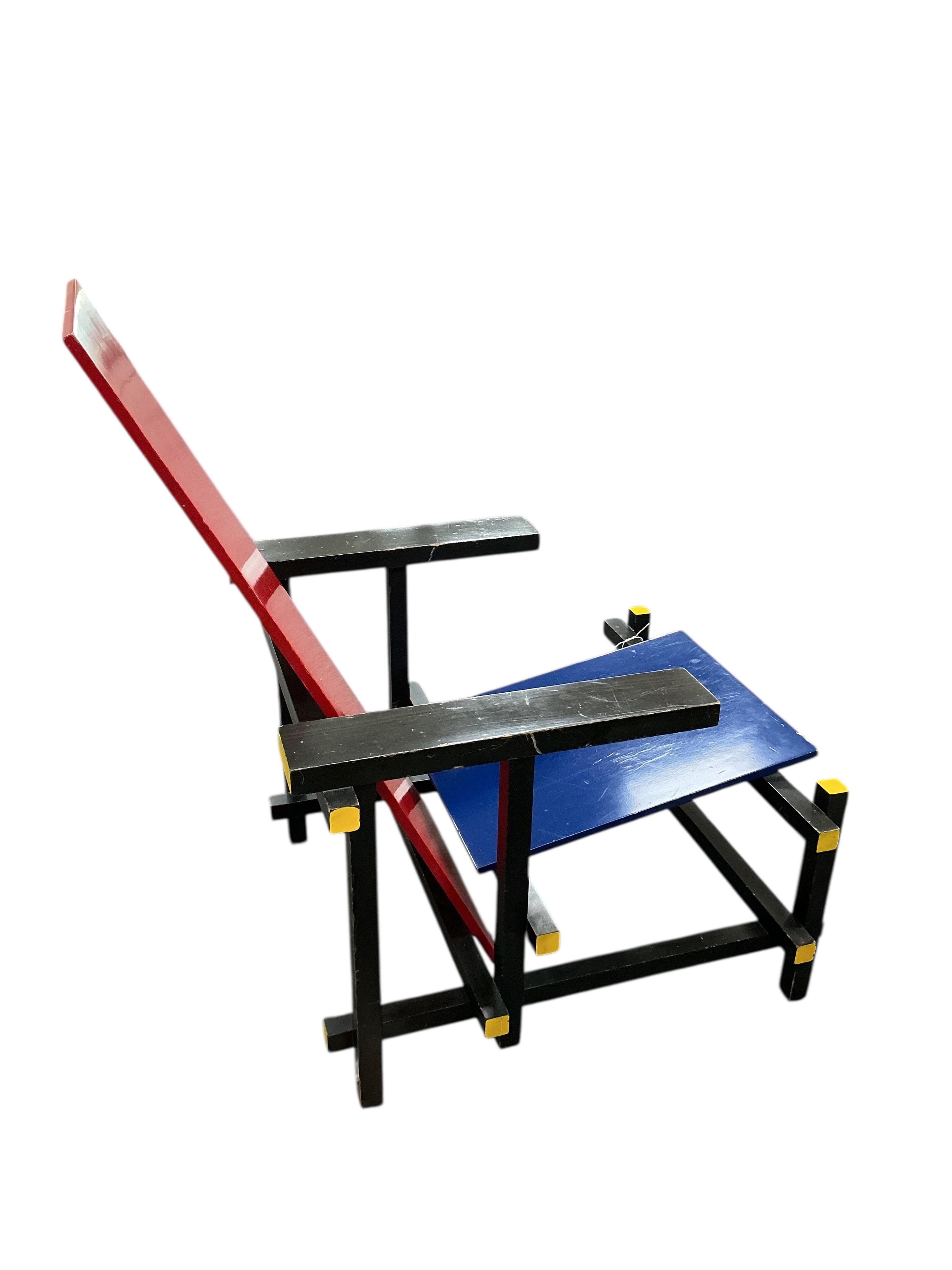 A red and blue chair by Gerrit Rietveld for cassina
